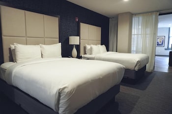 Deluxe Suite, 2 Queen Beds, City View (Separate Living/Dining, Shower only)